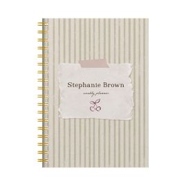 Floral panel diary with a gold pen and cup of hot chocolate on a pink background