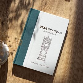 Dear Grandad journal on wooden table.