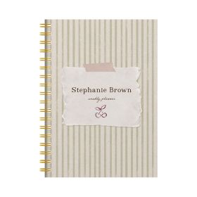 Floral panel diary with a gold pen and cup of hot chocolate on a pink background