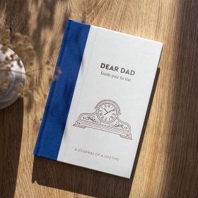 Dear Dad front cover on wooden table.